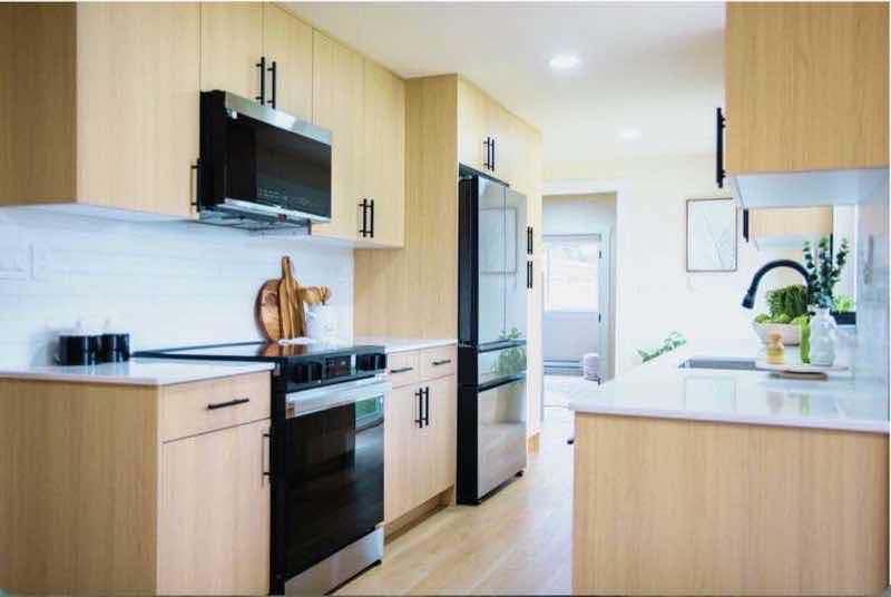 Frameless collection slim slab cabinets in a remodeled kitchen