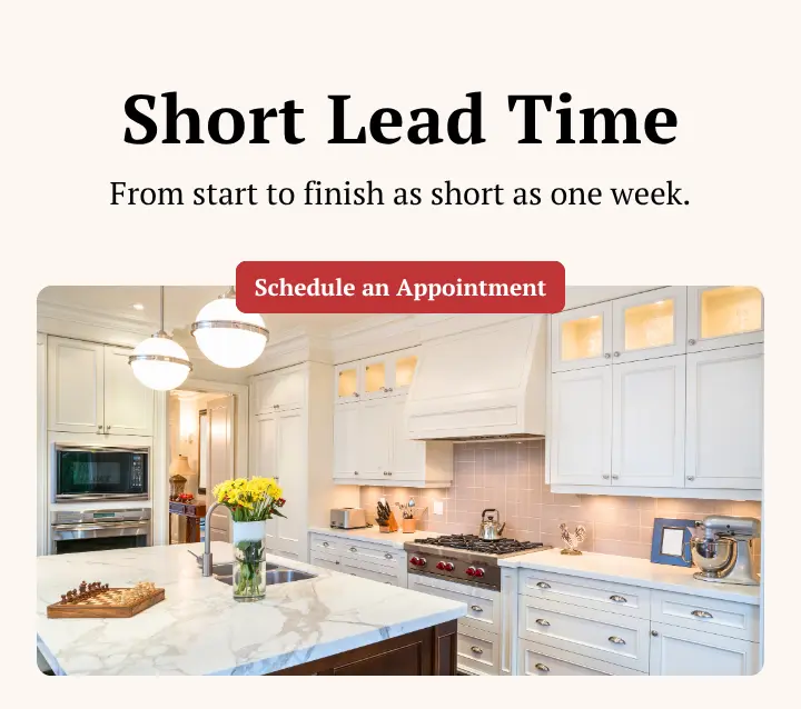 An advertisement for kitchen renovations highlighting a short lead time of as little as one week. The ad features a photo of a high-end kitchen with white cabinets and includes a red button to "Schedule an Appointment."